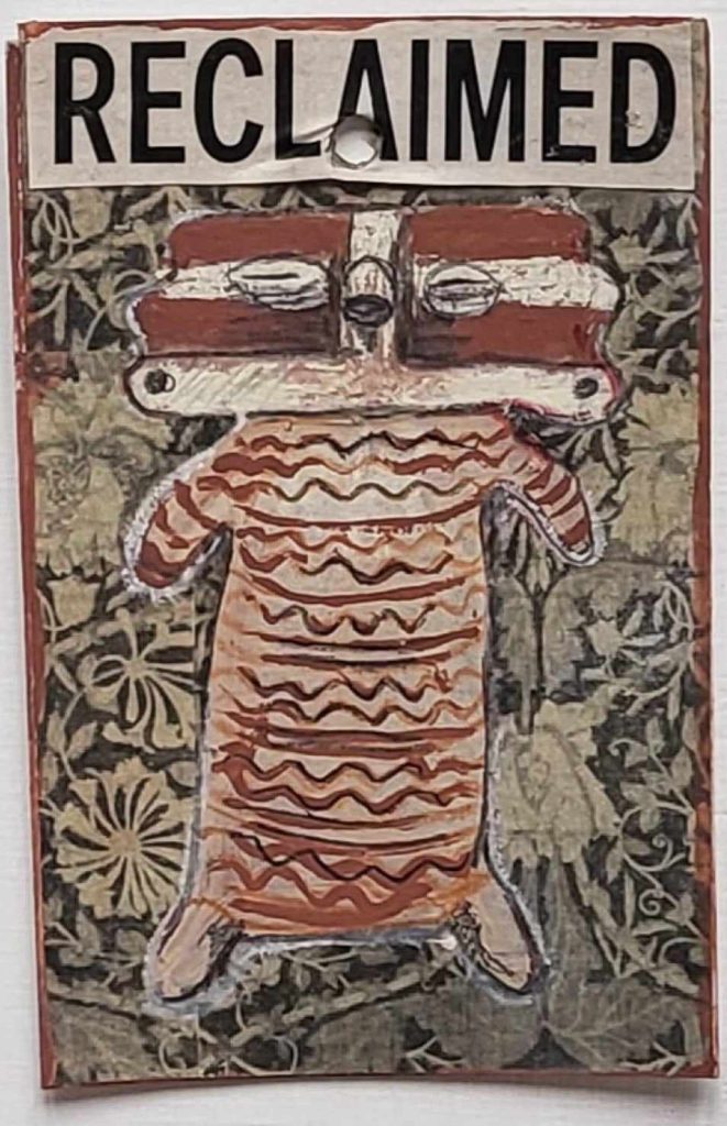 A painting of a ceramic figure that is house in Diego Rivera's temple in Mexico City. The figure is teracotta and has a wide head like a cartoon bear, its made up of horizontal stripes in terracotta and white. Above the head of the little figure is the word "Reclaimed" and the background is collage and floral.